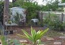 Potted plants along two fences now in ground